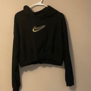 Nike women’s crop top sweatshirt, black with gold sparkly emblem, size small